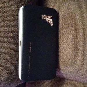 Black wallet with 8 pockets including change pocket